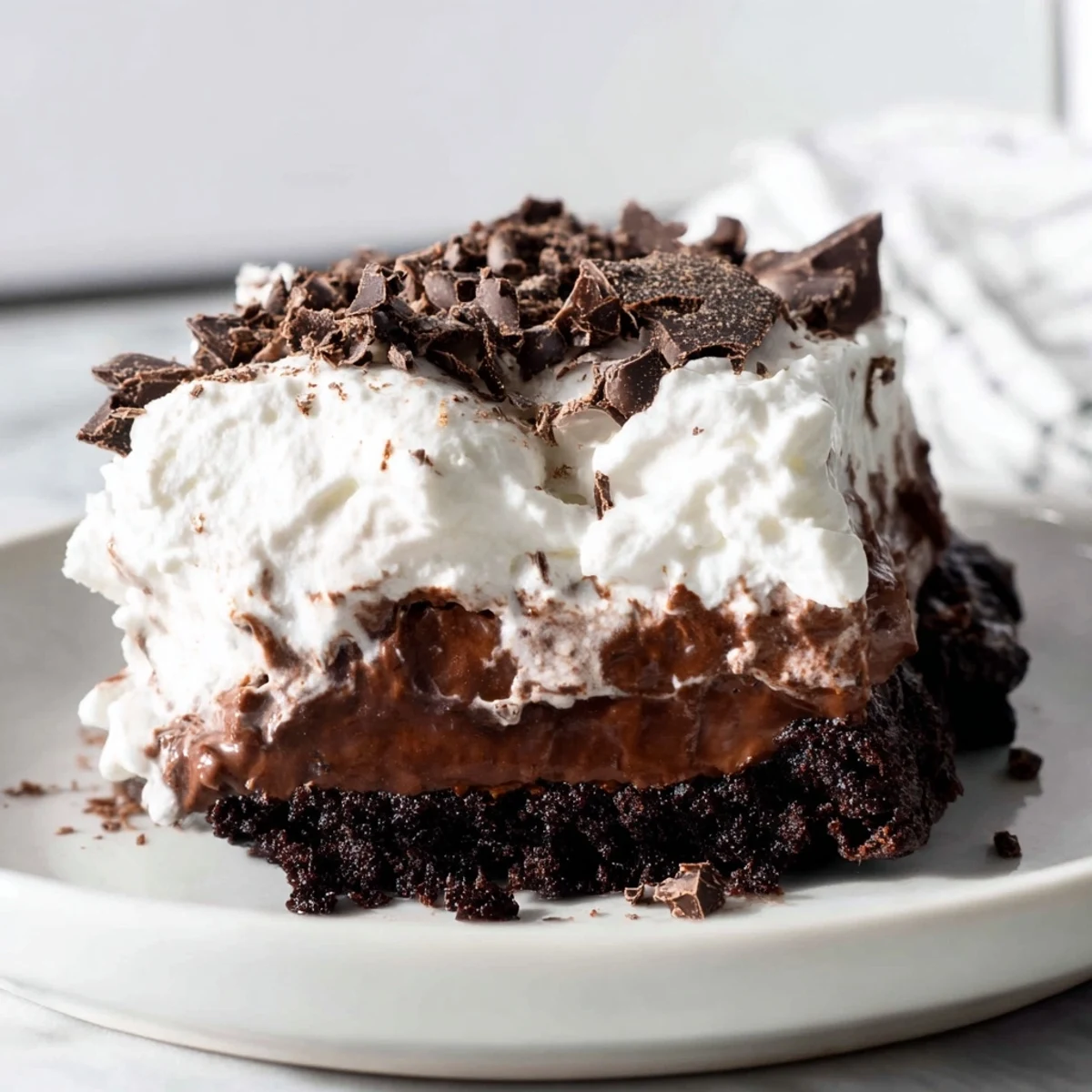 Enjoy a decadent slice of Mississippi Mud Pie, a perfect American chocolate dessert delight.