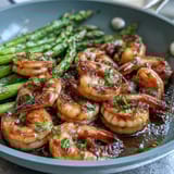 Vibrant one-pan lemon garlic shrimp and asparagus, roasted to perfection with bright citrus and savory garlic aroma wafting from the sheet pan.