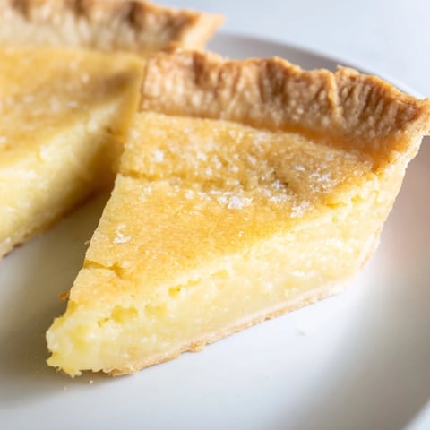 Golden chess pie, a Southern classic, with a bubbly, sugary top and buttery filling.