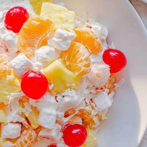 Classic American Ambrosia Salad, a sweet dessert combining mandarin oranges and coconut.