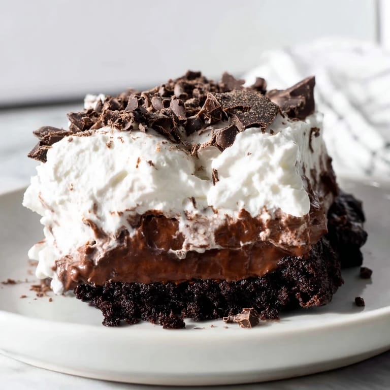 Enjoy a decadent slice of Mississippi Mud Pie, a perfect American chocolate dessert delight.