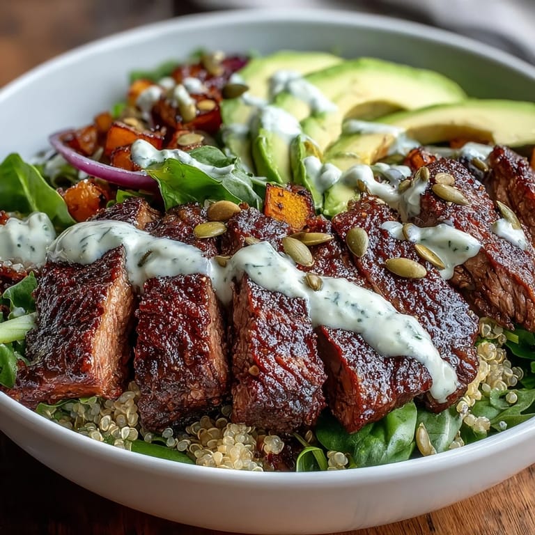 Hearty butternut squash steak bowls packed with caramelized squash, tender steak slices, pepitas, and fresh cilantro for a colorful dinner.