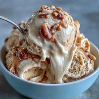 Creamy 4-Ingredient Peanut Butter Banana Ice Cream with swirls of peanut butter goodness.